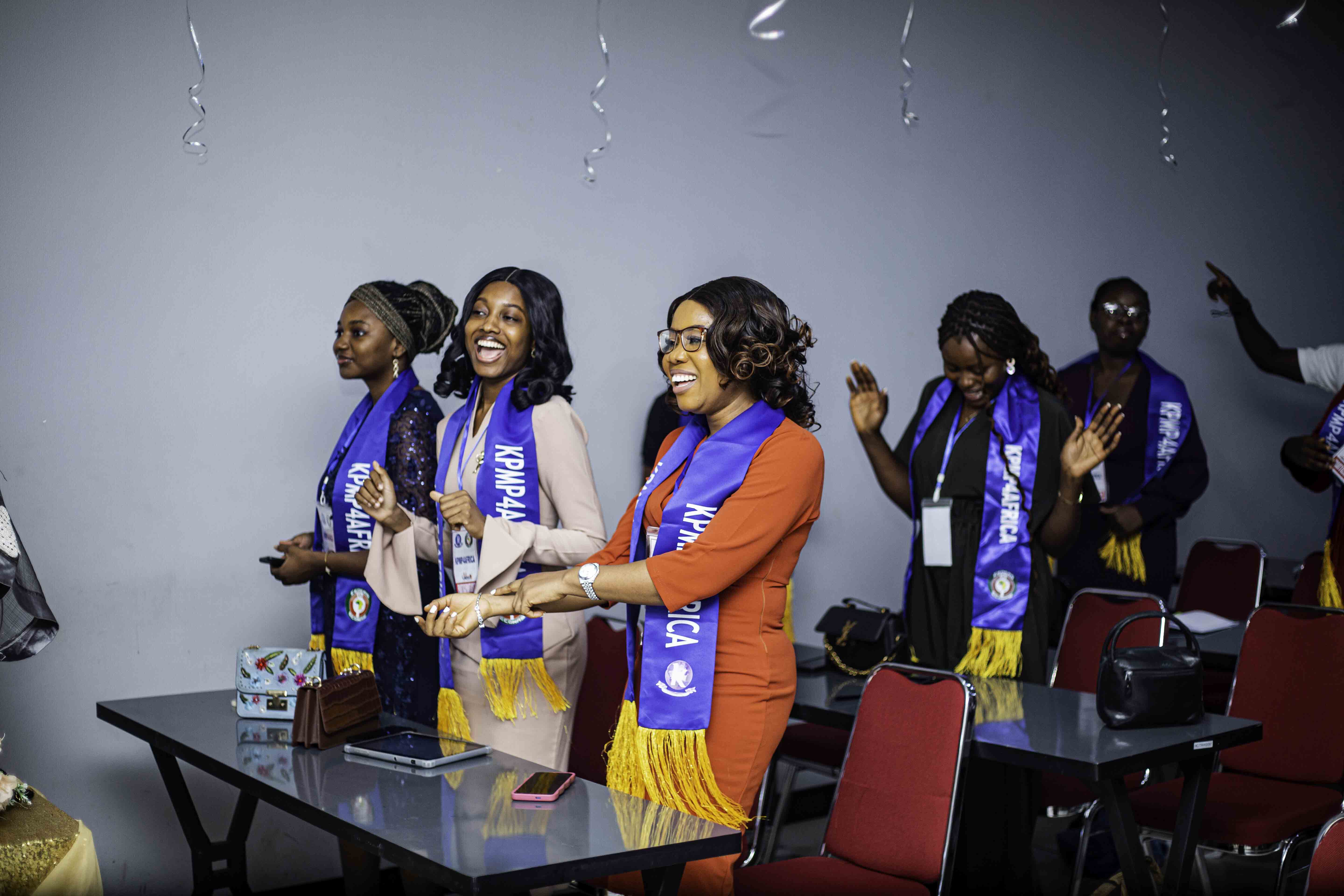 Group of diverse graduates smiling together